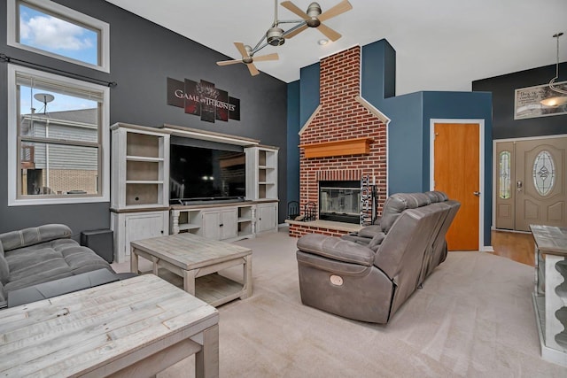 203 Jefferson St, Manteno, IL 60950 - living room with ceiling fan, a high ceiling, a fireplace, and carpet