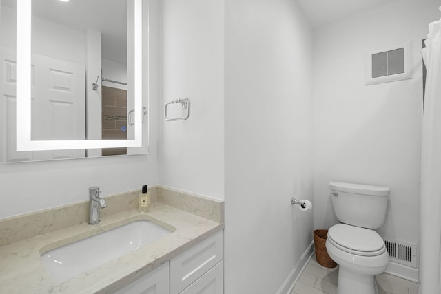 5135 S Kimbark Ave, Chicago, IL 60615 - bathroom featuring toilet, vanity, and baseboards