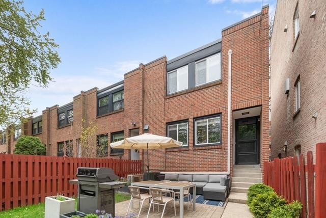 5135 S Kimbark Ave, Chicago, IL 60615 - back of property with brick siding and a patio