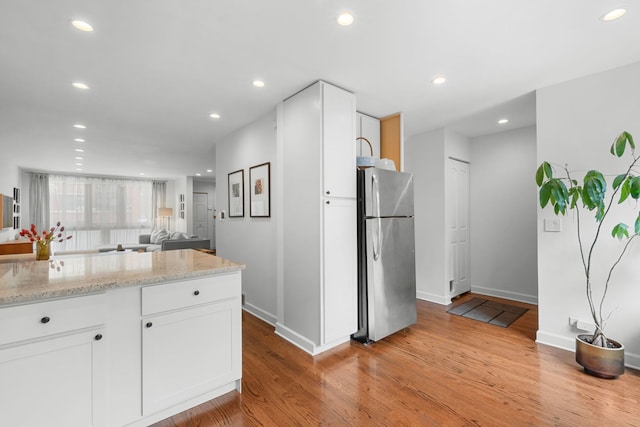 5135 S Kimbark Ave, Chicago, IL 60615 - kitchen featuring freestanding refrigerator, light wood-style flooring, baseboards, white cabinets, and recessed lighting