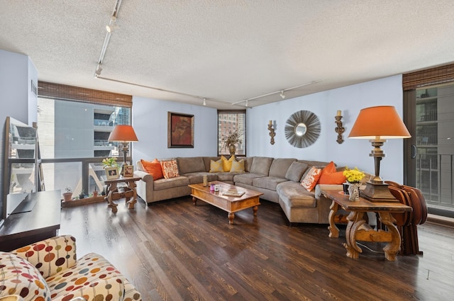 70 W Huron St Unit 708, Chicago, IL 60654 - living area with rail lighting, wood finished floors, and a textured ceiling