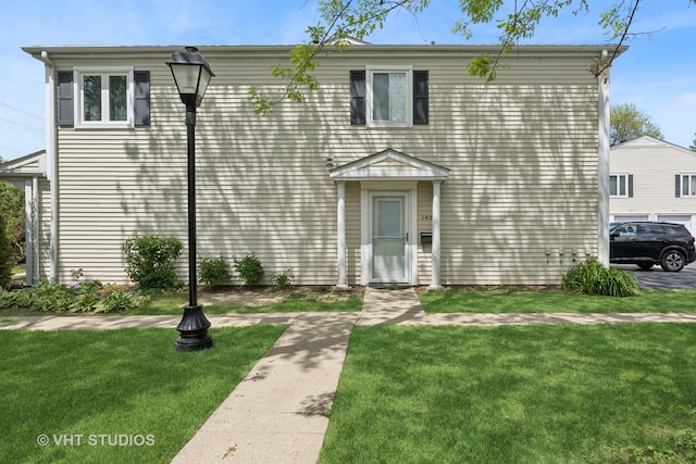 1426 Cove Dr Unit 237D, Prospect Heights, IL 60070 - view of front facade with a front yard
