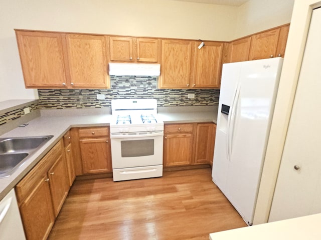 1249 Brookdale Dr Unit 1249, Carpentersville, IL 60110 - kitchen with white appliances, ventilation hood, light wood-style flooring, tasteful backsplash, and light countertops