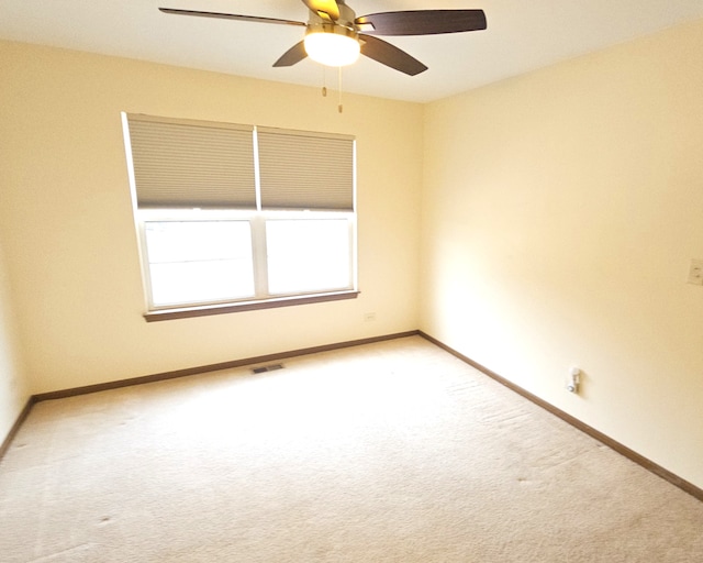 1249 Brookdale Dr Unit 1249, Carpentersville, IL 60110 - spare room featuring carpet, ceiling fan, and baseboards