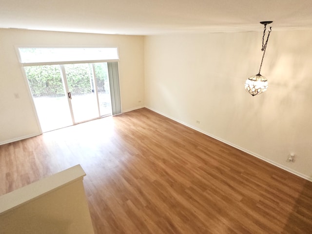 1249 Brookdale Dr Unit 1249, Carpentersville, IL 60110 - empty room with wood finished floors and baseboards