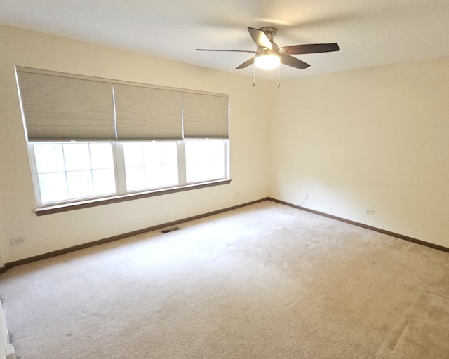 1249 Brookdale Dr Unit 1249, Carpentersville, IL 60110 - carpeted spare room featuring ceiling fan, healthy amount of natural light, and baseboards