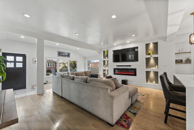 2705 Cuyler Ave, Berwyn, IL 60402 - living area featuring recessed lighting, built in features, a glass covered fireplace, light wood-style floors, and baseboards