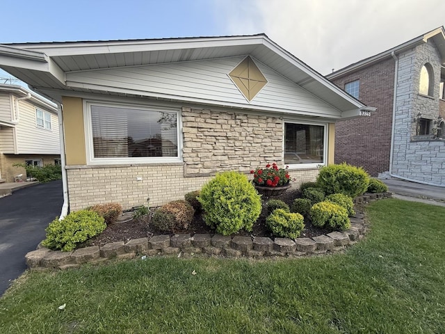 8325 W Maple Ave, Norridge, IL 60706 - view of front of house featuring brick siding and a front lawn