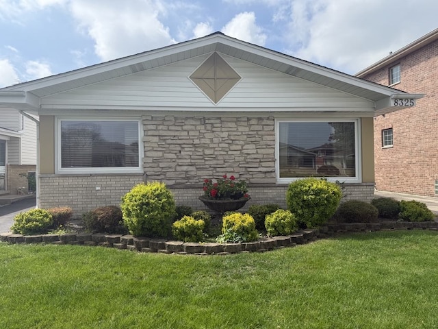 8325 W Maple Ave, Norridge, IL 60706 - view of property exterior featuring a yard and brick siding