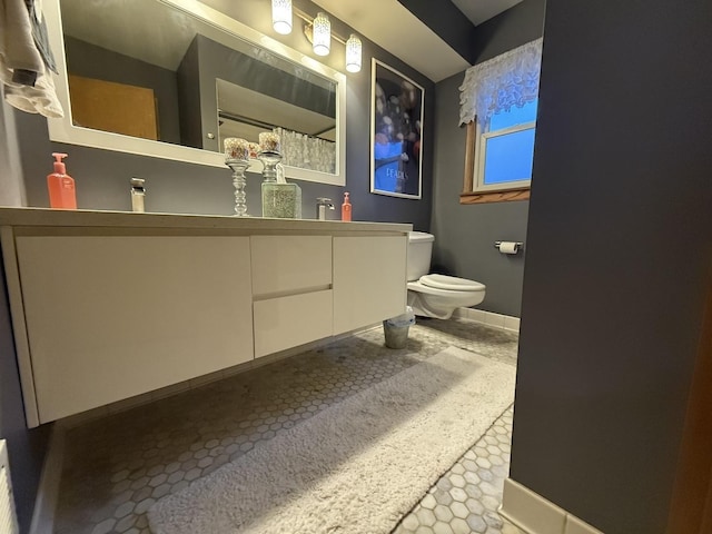 8325 W Maple Ave, Norridge, IL 60706 - bathroom with toilet, double vanity, baseboards, and a shower with shower curtain