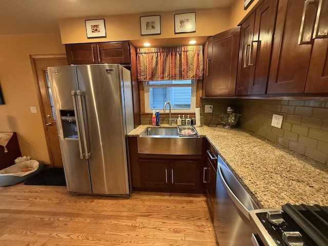 8325 W Maple Ave, Norridge, IL 60706 - kitchen featuring high end fridge, a sink, light wood finished floors, backsplash, and light stone countertops