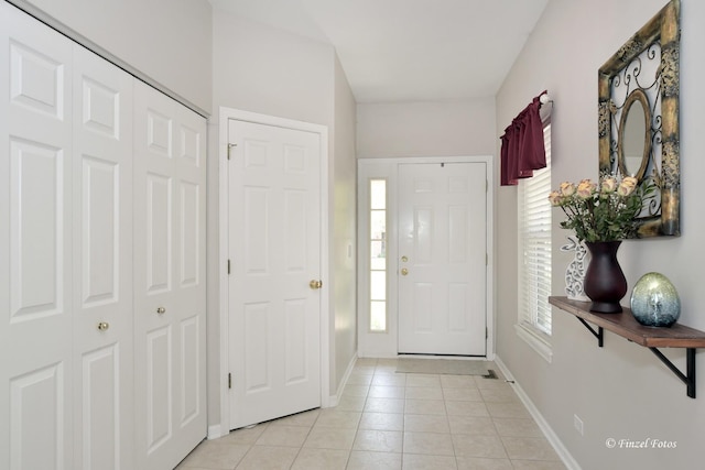 2402 Claremont Ln, Lake In The Hills, IL 60156 - entryway with light tile patterned floors and baseboards