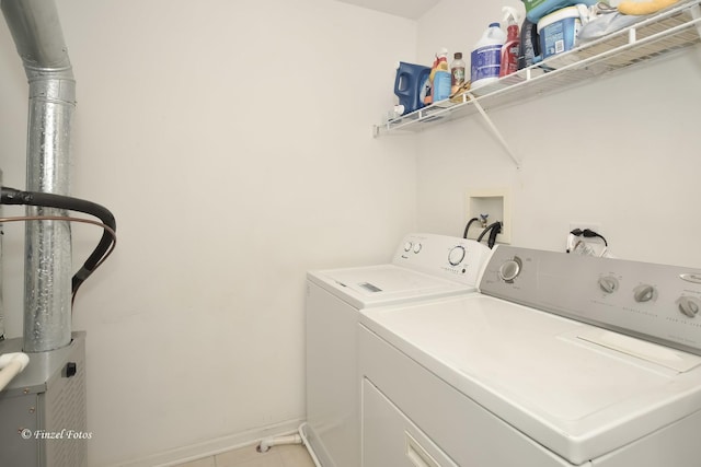 2402 Claremont Ln, Lake In The Hills, IL 60156 - clothes washing area featuring washing machine and clothes dryer and tile patterned flooring