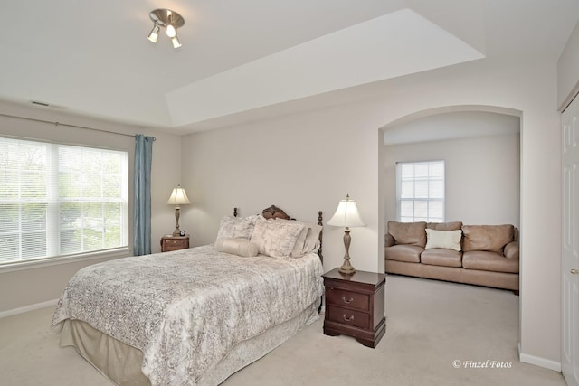 2402 Claremont Ln, Lake In The Hills, IL 60156 - bedroom featuring arched walkways, carpet floors, and baseboards