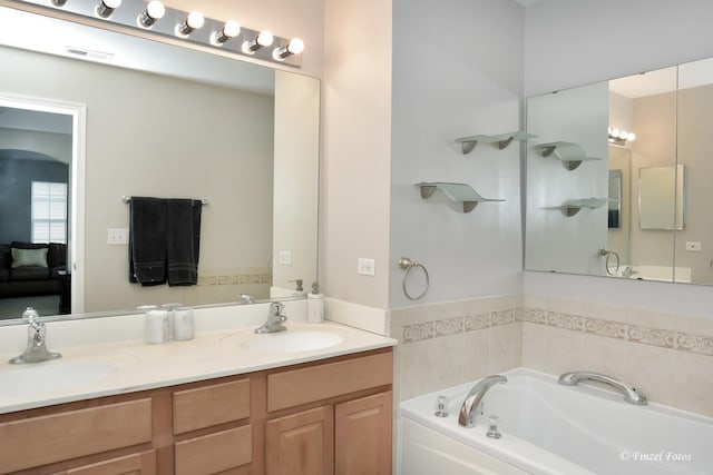 2402 Claremont Ln, Lake In The Hills, IL 60156 - bathroom with a garden tub and double vanity