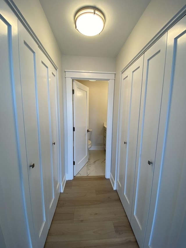 3930 N Pine Grove Ave Unit 1703, Chicago, IL 60613 - corridor featuring baseboards and marble finish floors
