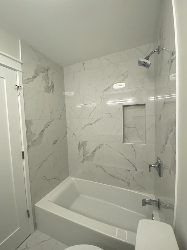 3930 N Pine Grove Ave Unit 1703, Chicago, IL 60613 - bathroom featuring shower / tub combination, marble look tile flooring, and toilet