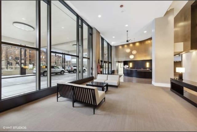 3930 N Pine Grove Ave Unit 1703, Chicago, IL 60613 - community lobby with a wall of windows and recessed lighting