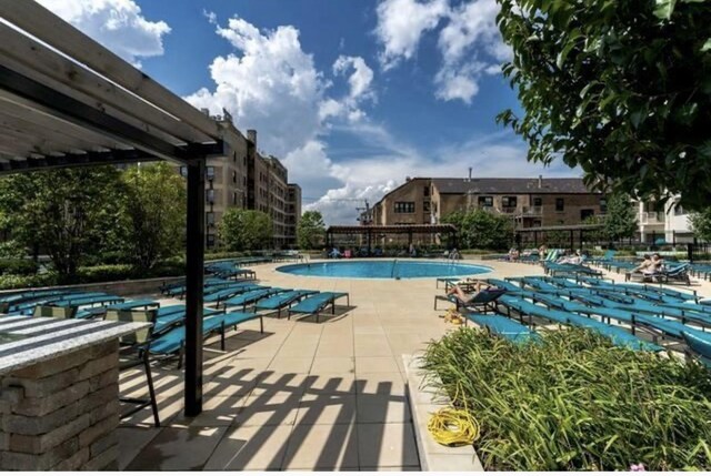 3930 N Pine Grove Ave Unit 1703, Chicago, IL 60613 - community pool featuring a patio and fence
