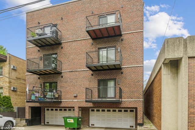 6436 N Lehigh Ave Unit 2N, Chicago, IL 60646 - view of property with a garage and driveway