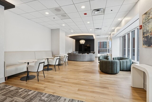 512 N Mcclurg Ct Unit 4904, Chicago, IL 60611 - living room featuring wood finished floors, recessed lighting, and a drop ceiling