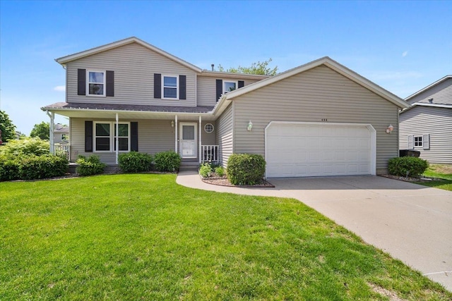 408 Lake Shore Cir, Bloomington, IL 61704 - view of front of home featuring a garage, driveway, a front yard, and a porch