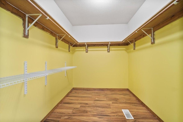 408 Lake Shore Cir, Bloomington, IL 61704 - spacious closet featuring wood finished floors