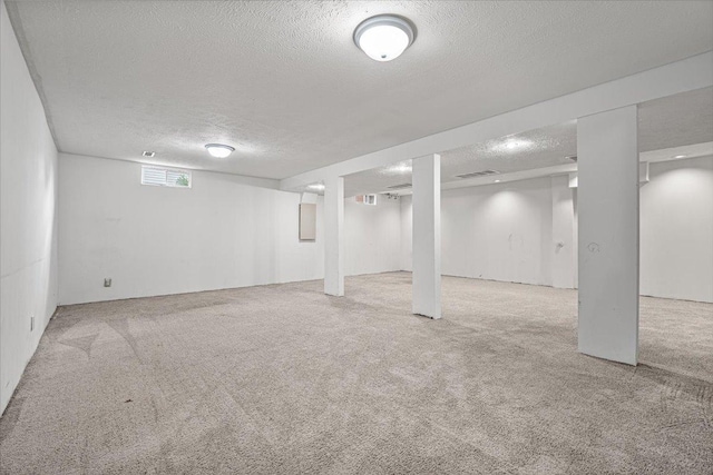 408 Lake Shore Cir, Bloomington, IL 61704 - below grade area with a textured ceiling, carpet floors, and electric panel
