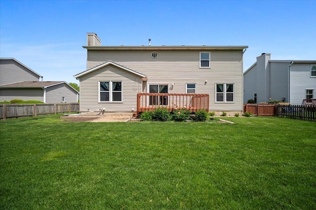 408 Lake Shore Cir, Bloomington, IL 61704 - rear view of house with a wooden deck and a chimney