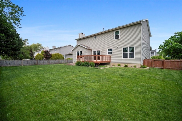 408 Lake Shore Cir, Bloomington, IL 61704 - back of property featuring a wooden deck and a chimney