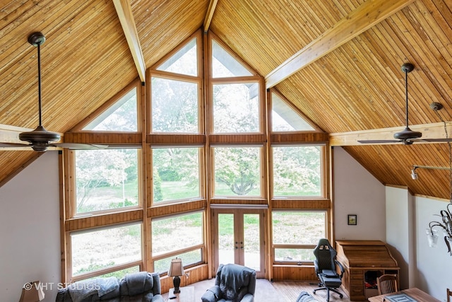 living area featuring high vaulted ceiling, wood ceiling, french doors, and beam ceiling
