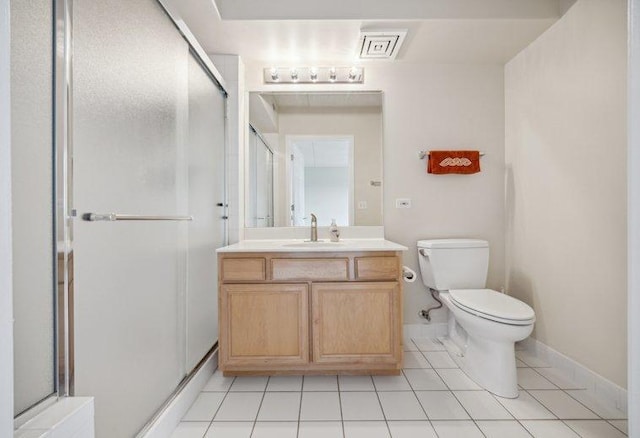 full bathroom with tile patterned floors, a stall shower, toilet, and vanity