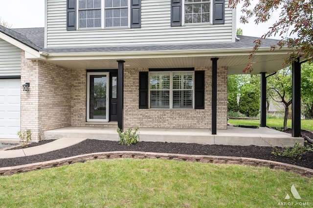 entrance to property with covered porch, brick siding, a shingled roof, and a garage