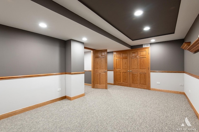 finished basement with recessed lighting, light carpet, and baseboards