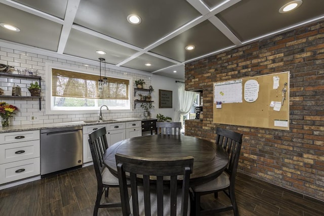 dining area with coffered ceiling, dark wood-style flooring, brick wall, beam ceiling, and recessed lighting