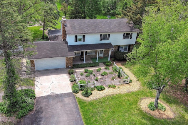 38W283 Deerpath Rd, Batavia, IL 60510 - traditional-style home with covered porch, driveway, a garage, brick siding, and a chimney
