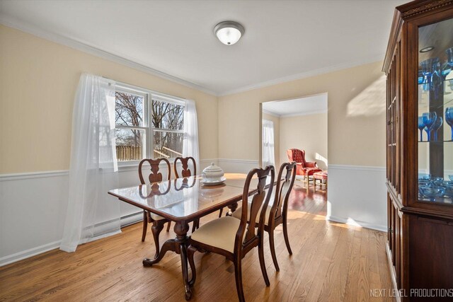 38W283 Deerpath Rd, Batavia, IL 60510 - dining area featuring a baseboard heating unit, light wood-type flooring, crown molding, and baseboards