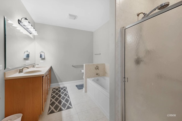bathroom featuring tile patterned flooring, a stall shower, a garden tub, double vanity, and baseboards