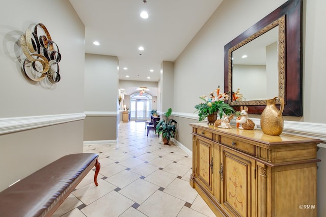 hallway with recessed lighting and baseboards