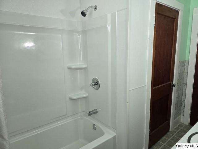 301 N St, Augusta, IL 62311 - bathroom featuring shower / bath combination and tile patterned floors
