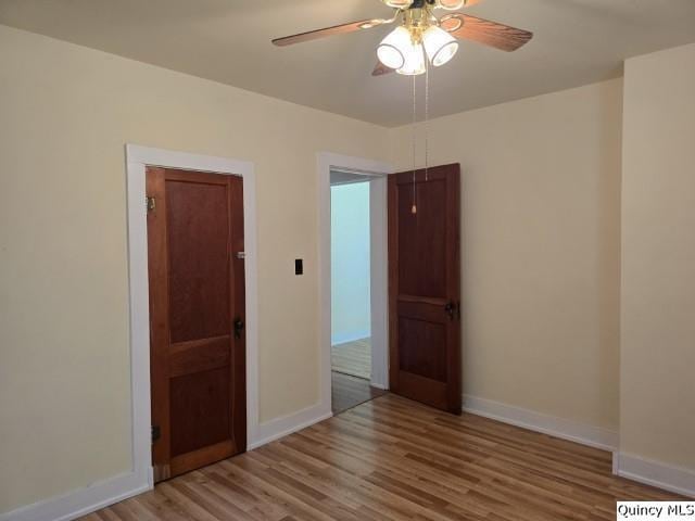 301 N St, Augusta, IL 62311 - empty room with baseboards and wood finished floors