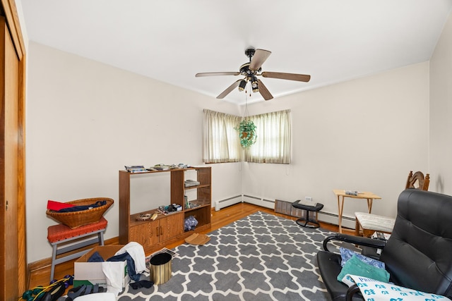 3707 Clarence Ave, Berwyn, IL 60402 - living area featuring ceiling fan, wood finished floors, and baseboard heating