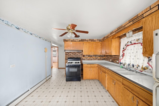 3707 Clarence Ave, Berwyn, IL 60402 - kitchen with range with gas stovetop, baseboard heating, a sink, light flooring, and ceiling fan