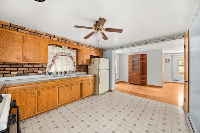 3707 Clarence Ave, Berwyn, IL 60402 - kitchen featuring freestanding refrigerator, baseboard heating, light flooring, ceiling fan, and light countertops