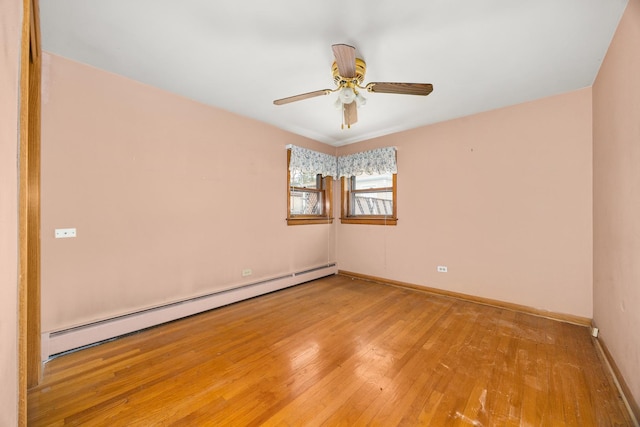 3707 Clarence Ave, Berwyn, IL 60402 - unfurnished room featuring a baseboard radiator, wood finished floors, baseboards, and ceiling fan
