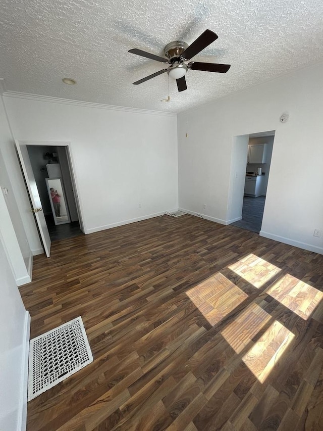 617 W Madison St, Pontiac, IL 61764 - unfurnished room featuring wood finished floors, a ceiling fan, a textured ceiling, baseboards, and crown molding
