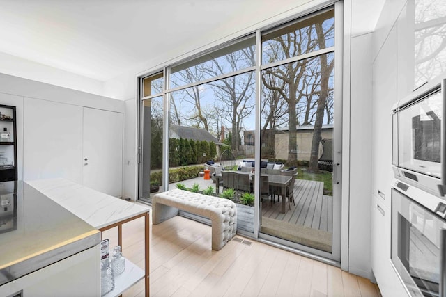 824 Humboldt Ave, Winnetka, IL 60093 - doorway with wood finished floors and healthy amount of natural light