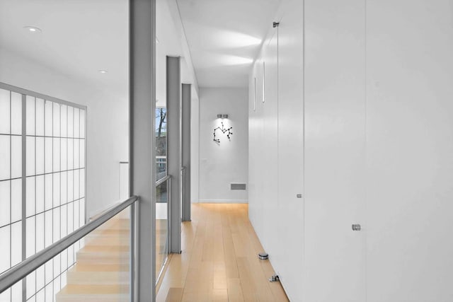824 Humboldt Ave, Winnetka, IL 60093 - corridor featuring light wood-style flooring, baseboards, and recessed lighting