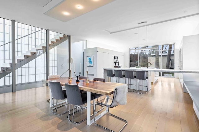 824 Humboldt Ave, Winnetka, IL 60093 - dining space featuring light wood-style floors and stairway