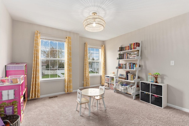 173 Willowwood Dr N, Oswego, IL 60543 - recreation room featuring a chandelier, carpet, and baseboards